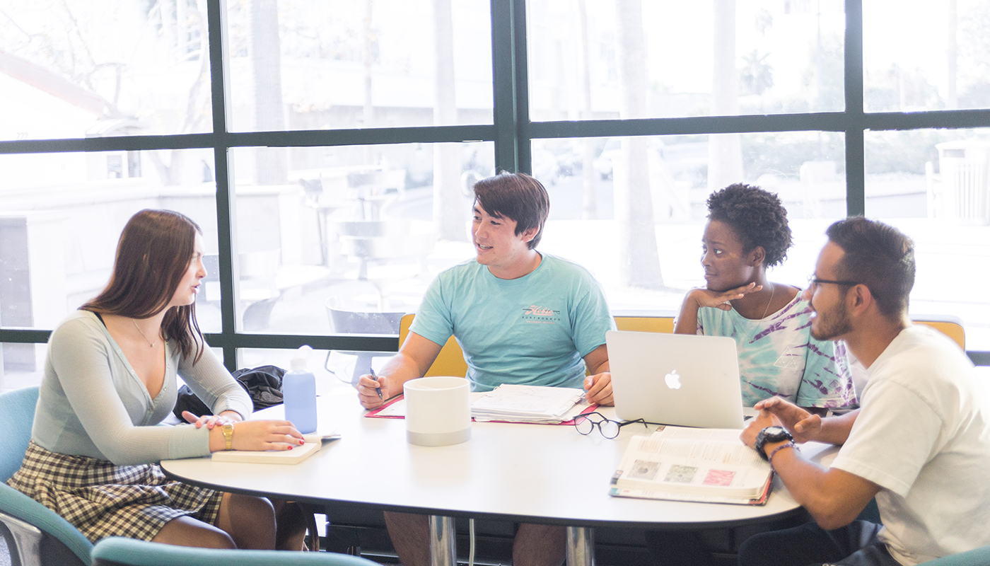 The Jack & Julie Nadel School of Business and Entrepreneurship lobby with students studying in it.