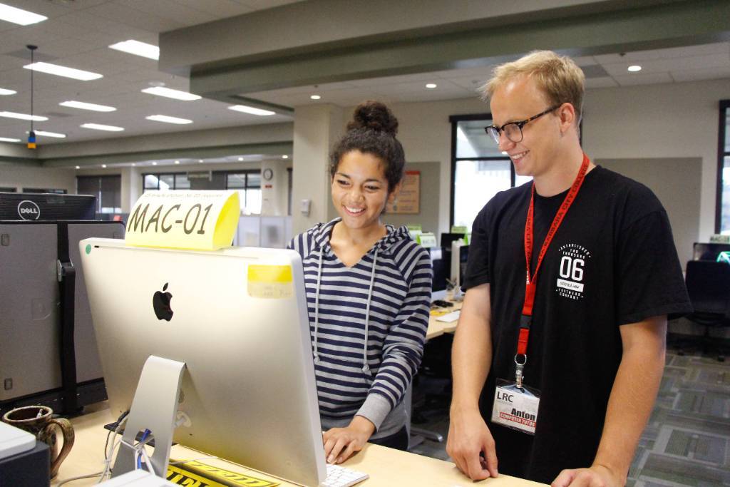 Student getting help using computer