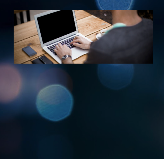image of student on laptop working