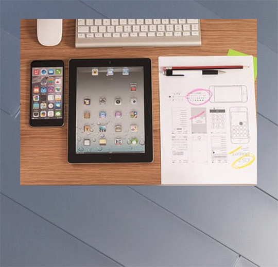 image of notes, keyboard, phone, and tablet