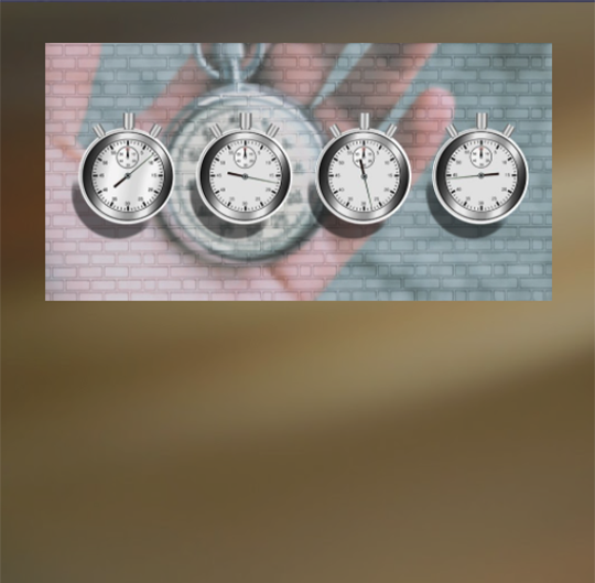 image of stop watches against a brick wall