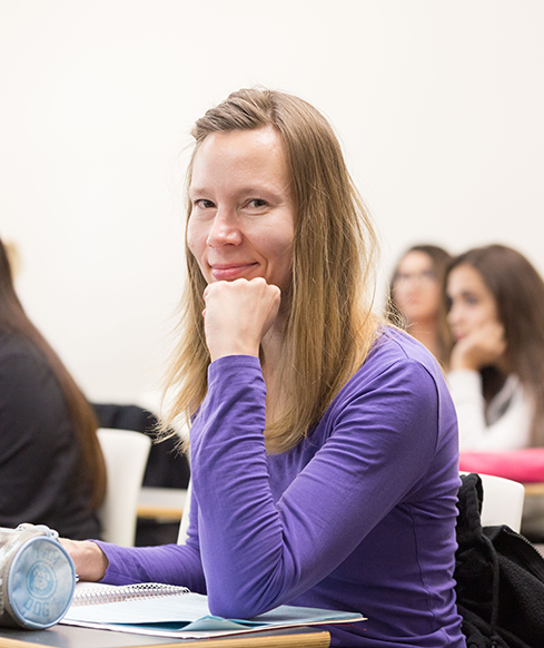 Female SBCC international student at a desk.