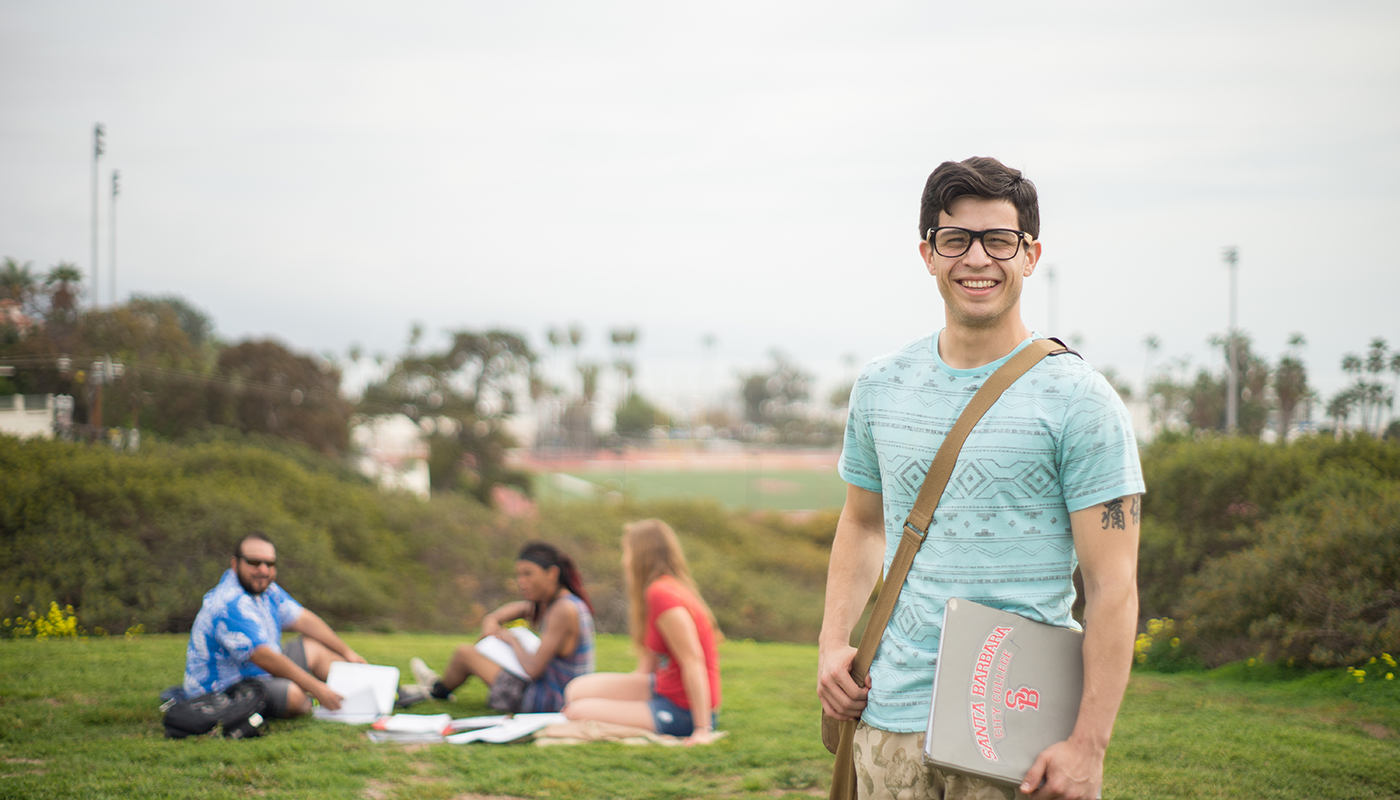 Male SBCC student with friends on west campus.