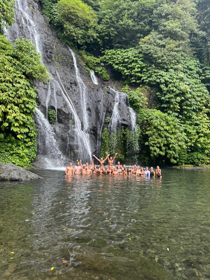 Students in Bali, Fall 2024, enjoying one of many waterfalls.